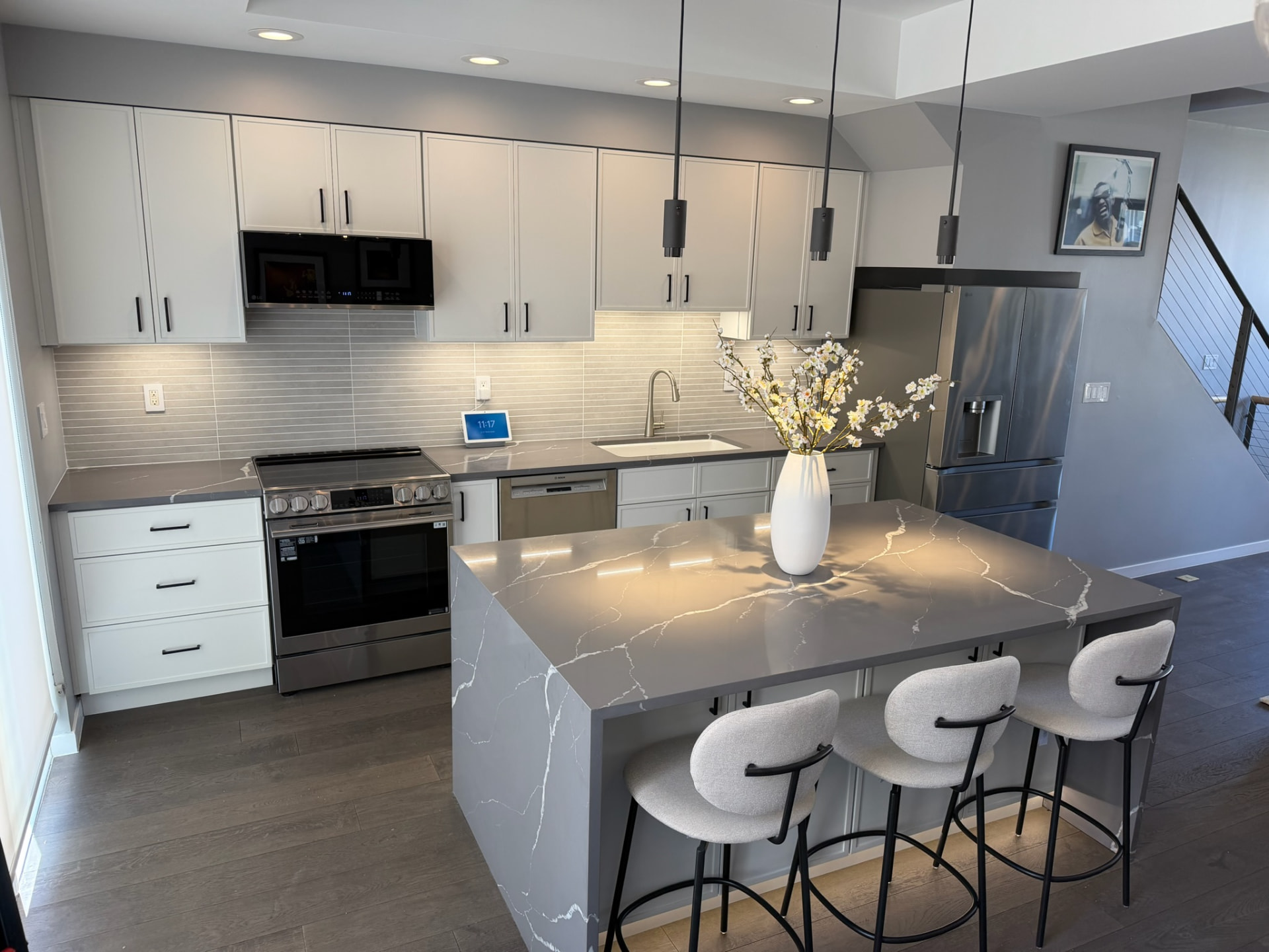 Remodeled kitchen with range, oversized island, and seating